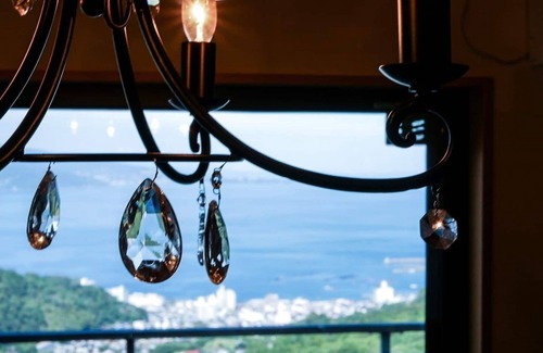 Shimotaga House | A spectacular view! Relax on the sea-view terrace/Scandinavian log house with hot spring & fireplace