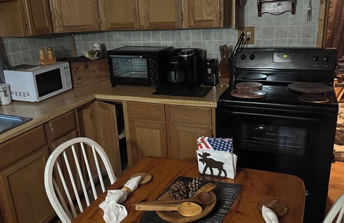 Mio Cabin | A Stream runs through it. Comfy little cabin with a stream by your bedroom.