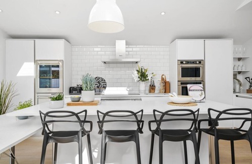Windsor House | A stunning five-bedroom home located in the heart of Windsor driveway parking!