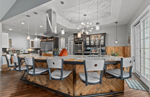 Forest Junction House | A warm & inviting modern retreat featuring on-site local brews & a home theater.