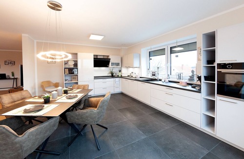Grasberg Apartment | Above the Rooftops of Grasberg's City