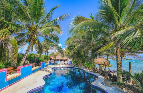 Akumal Condo | Affordable right on the beach! Beautiful colorful setting!