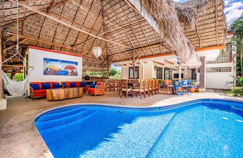 Coco House | Airy oasis with a grand outdoor space, private pool, & shared tennis court