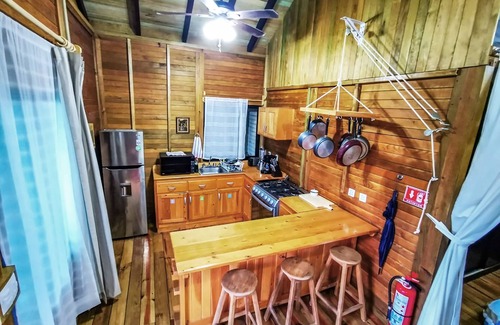 La Veleta Cabin | Alicat Villas: Unique spacious wood cabin, w/balcony overlooking pool Fast wifi