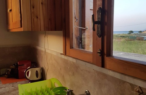 Trachilos Cottage | All season lovely seafront cottage, breakfast included, family friendly