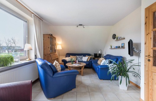 Suden Apartment | Allergy-friendly holiday flat 'Bi uns to hus - Morgensünn' with terrace, garden and WLAN