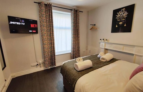 Landore Apartment | Alma Accommodation - TV in Every Bedroom!
