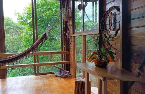Banos de Agua Santa Cabin | Amanecer Amazonico - Rustic cabin with Amazon rainforest view