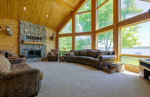 Alexandria Cabin | Amazing lake home on level lot with loft above garage paddle boat