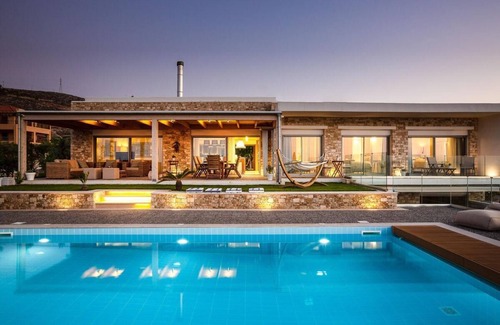 Vathianos Kampos Villa | Amazing location and views with a heated covered pool