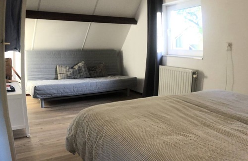 Ouddorp House | An absolute plus for this home is the party covered terrace facing south, with a comfortable, atmospheric lounge set.