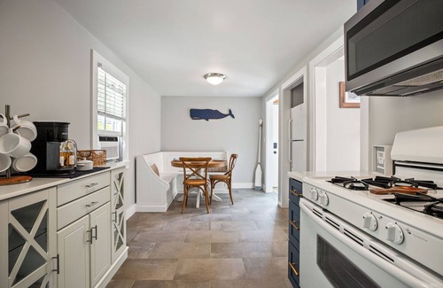 South Dennis House | An elevated Cape Cod escape close to coveted beaches with fully fenced yard, new deck and firepit