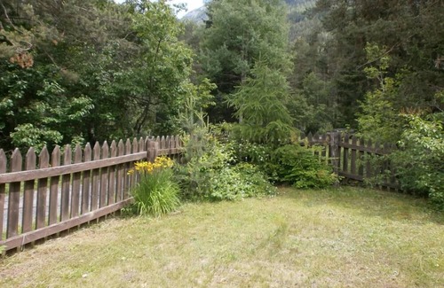 Sent House | Ancient typical Engadine mill on a stream near the woods and walks