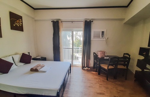 Mactan Export Processing Zone Apartment | ANIA GUEST ROOM with balcony near Mactan Airport.