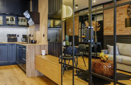 Nowy Targ Apartment | APARTAMENT CHICAGO - stylowy apartament z KLIMATYZACJĄ o bardzo wysokim standardzie w centrum miasta, z prywatnym zadaszonym parkingiem - IZBY PODHALAŃSKIE