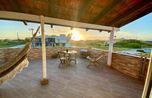 Laguna Apartment | Apartamentos exclusivos e equipado com varanda ou terraço com Pôr do sol, cozinha privativa, Wi-Fi 600MBs, a 700m da praia de Itapirubá e 1km da BR-101