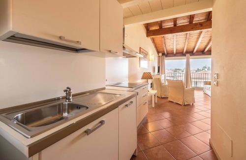 San Felice del Benaco Apartment | Apartment 'Antica Torre Byron' with Shared Pool, Wi-Fi and Air Conditioning