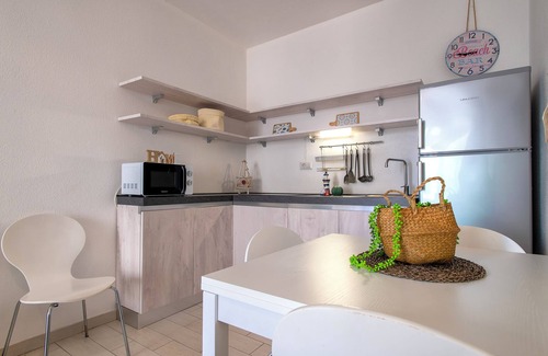 Trinita d'Agultu e Vignola Apartment | Apartment 'Borgo Degli Ulivi' with Private Garden and Air Conditioning