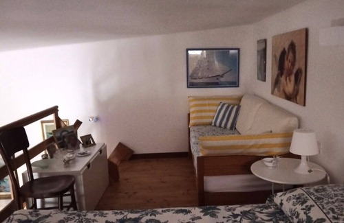 Portoscuso Apartment | Apartment 'Casetta Silvia' with Shared Pool, Private Terrace and Air Conditioning