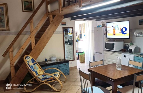 Portoscuso Apartment | Apartment 'Casetta Silvia' with Shared Pool, Private Terrace and Air Conditioning