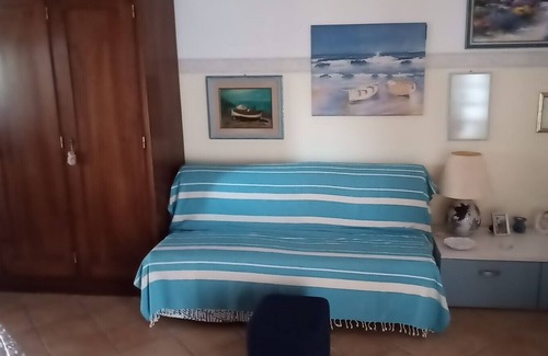 Portoscuso Apartment | Apartment 'Casetta Silvia' with Shared Pool, Private Terrace and Air Conditioning