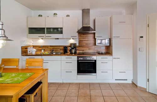 Norddeich Apartment | Apartment 'Ferienwohnung Neue Sande' with Private Garden, Balcony and Wi-Fi