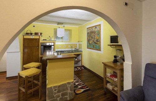 Carciano Ski Chalet | Apartment in stone chalet surrounded by greenery a few steps from the lake