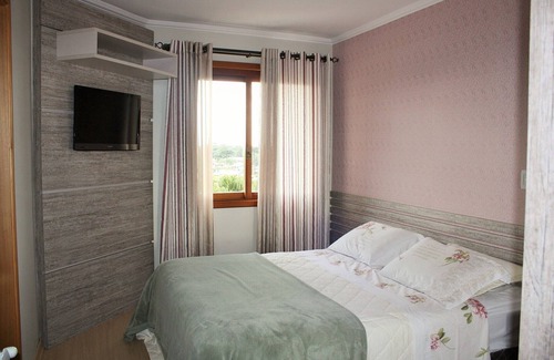 Floresta Apartment | Apartment in the center of Gramado with view, fireplace and hydro bath