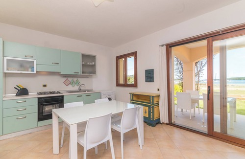 Porto Pozzo Apartment | Apartment “I Mirti di Porto Pozzo” close to the Beach with Sea View, Garden & Terrace