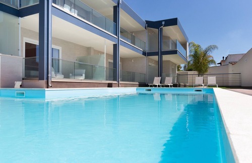 Villa San Pietro Apartment | Apartment "Residence Meridian Unità 4" Near the Beach with Mountain View, Pool, A/C, Wi-Fi & Balcony