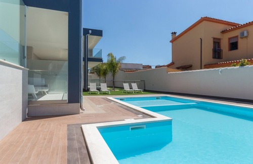 Villa San Pietro Apartment | Apartment "Residence Meridian Unità 4" Near the Beach with Mountain View, Pool, A/C, Wi-Fi & Balcony