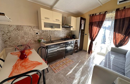 Agnone Bagni Apartment | Apartment 'Serena A Due Passi Dal Mare' with Shared Garden, Wi-Fi and Air Conditioning