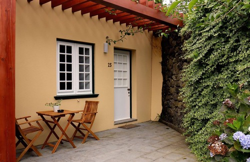 Angra do Heroismo Apartment | Apartment Suite embraced by a farm with exotic vegetation.