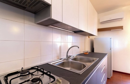 Trinita d'Agultu e Vignola Apartment | Apartment "Veranda borgo Isola Rossa" with Sea View, A/C, Wi-Fi & terrace; (Pets friendly)