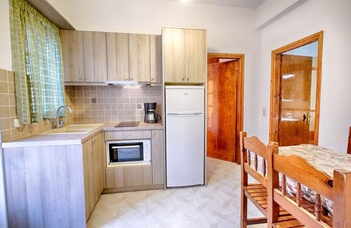 Agios Georgios Pagon Apartment | Apartment with sea views - 50 m from the sandy beach - 2 bedrooms - corner apartment with large