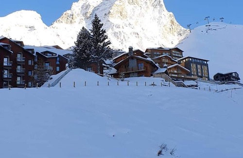 Cervinia Apartment | apartment with mezzanine and fireplace