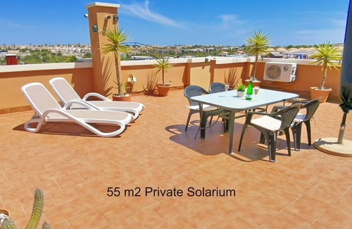 Orihuela Costa Apartment | Apartment with Large Roof Solarium, Pool, Garden, Barbecue, A/C & Wi-Fi