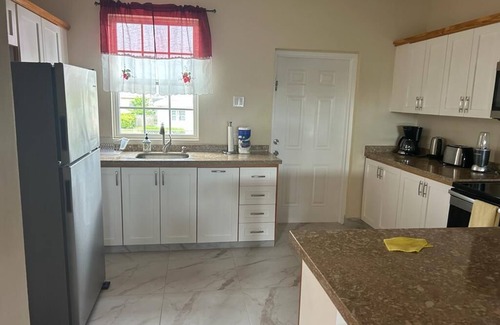 Enterprise House | Apt #1-Newly built apartments, great for families/friends, minutes walk to beach