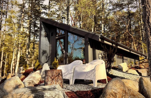 Halfmoon Bay Cabin | Arbutus Ridge, a cozy, architecturally unique cabin surrounded by arbutus trees