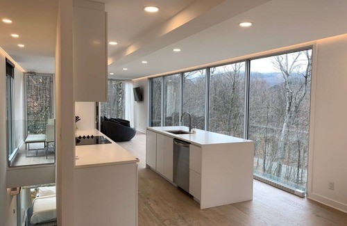 Lac Superieur Village Ski Chalet | Architectural home with panoramic mountain views.
