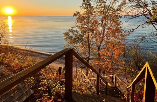 Laurium House | **Artistry view of Lake Superior with the allurement of Upper Entry Lighthouse *