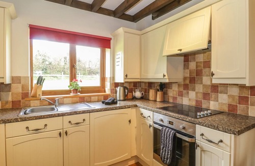 Watchet Cottage | ASH LODGE, pet friendly, with hot tub in Washford