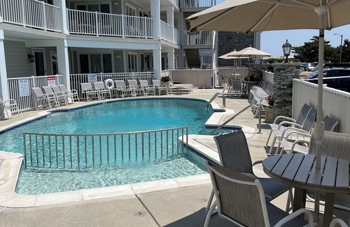 Avalon Condo | AVALON BEACH BLOCK! Renovated, Luxury condo W/heated pool steps to everything