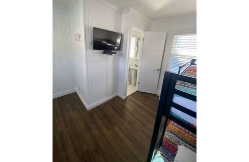 Ludington Apartment | Avenue Flats #1 - Walk to shops and restaurants - Hosted by Simple Lyfe Stays