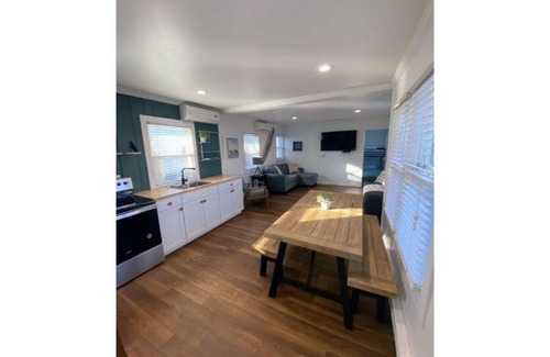 Ludington Apartment | Avenue Flats #1 - Walk to shops and restaurants - Hosted by Simple Lyfe Stays