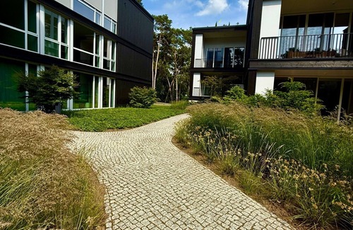 Bad Saarow Apartment | Bad Seerose, cozy vacation apartment with lake view, roof terrace, pool and sauna