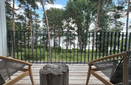 Bad Saarow Apartment | Bad Seerose, cozy vacation apartment with lake view, roof terrace, pool and sauna