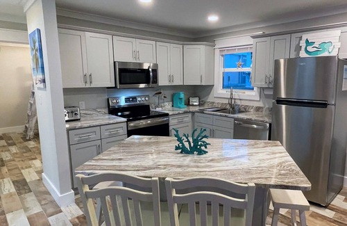 Bid-a-wee Beach House | Barefoot Bungalow- Steps to Private Beach, 5-Star Comfort & Near Top Attractions