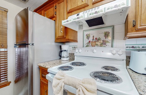 South Padre Island Condo | Bay-view all-suite condo with pool & fishing dock - walk to beach