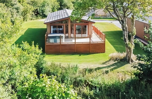 Llansantffraed Ski Chalet | Bay view lodge offers just that, breathtaking views of Ceredigion Bay.